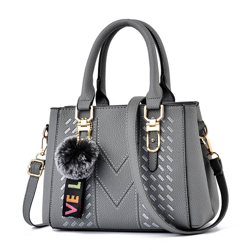 Handbag with Charm: Clean Look with a Playful Twist
